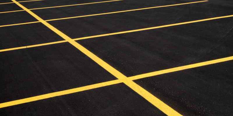 Parking lot striping can be done using either paint or molten thermoplastic