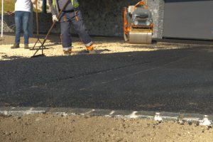 How Can an Asphalt Paving Contractor Help You Avoid Legal Liabilities?